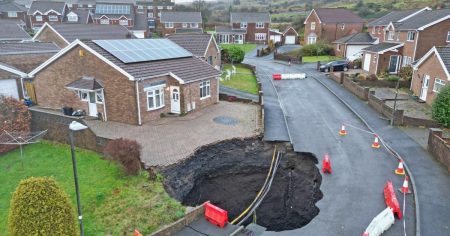 50ft sinkhole swallows housing estate, dozens evacuated