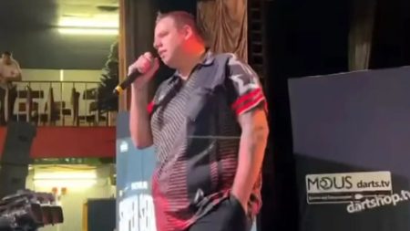 Two-Time Darts Champion Delights Fans with Impromptu Robbie Williams Performance