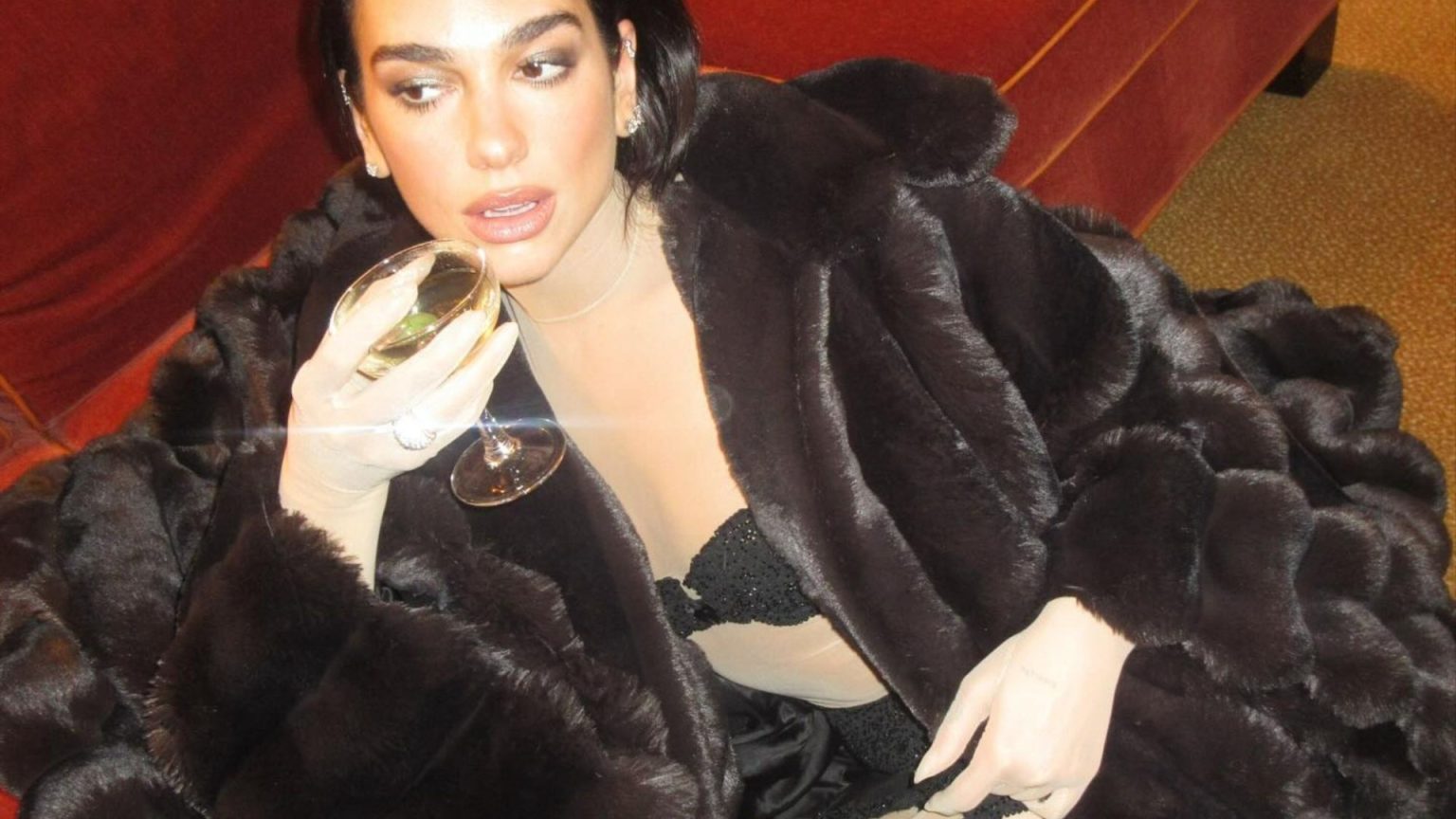Dua Lipa Makes a Bold Fashion Statement in Stockings and Fur Coat