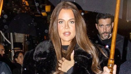 Khloe Kardashian Emerges from London Hotel in Sheer Tights and Fur Coat.