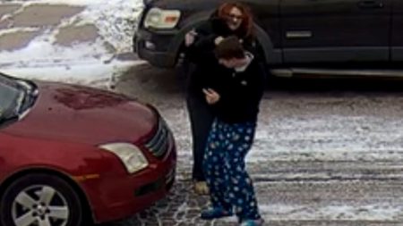 Physical Altercation Erupts Between Man and Woman on Icy Roadway
