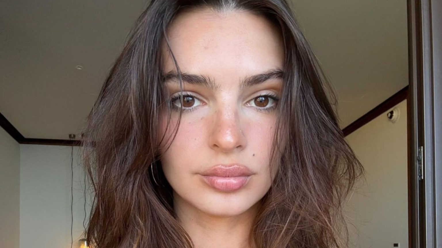 Emily Ratajkowski Stuns in Red While Sunbathing Following Valentine’s Day Collection Reveal
