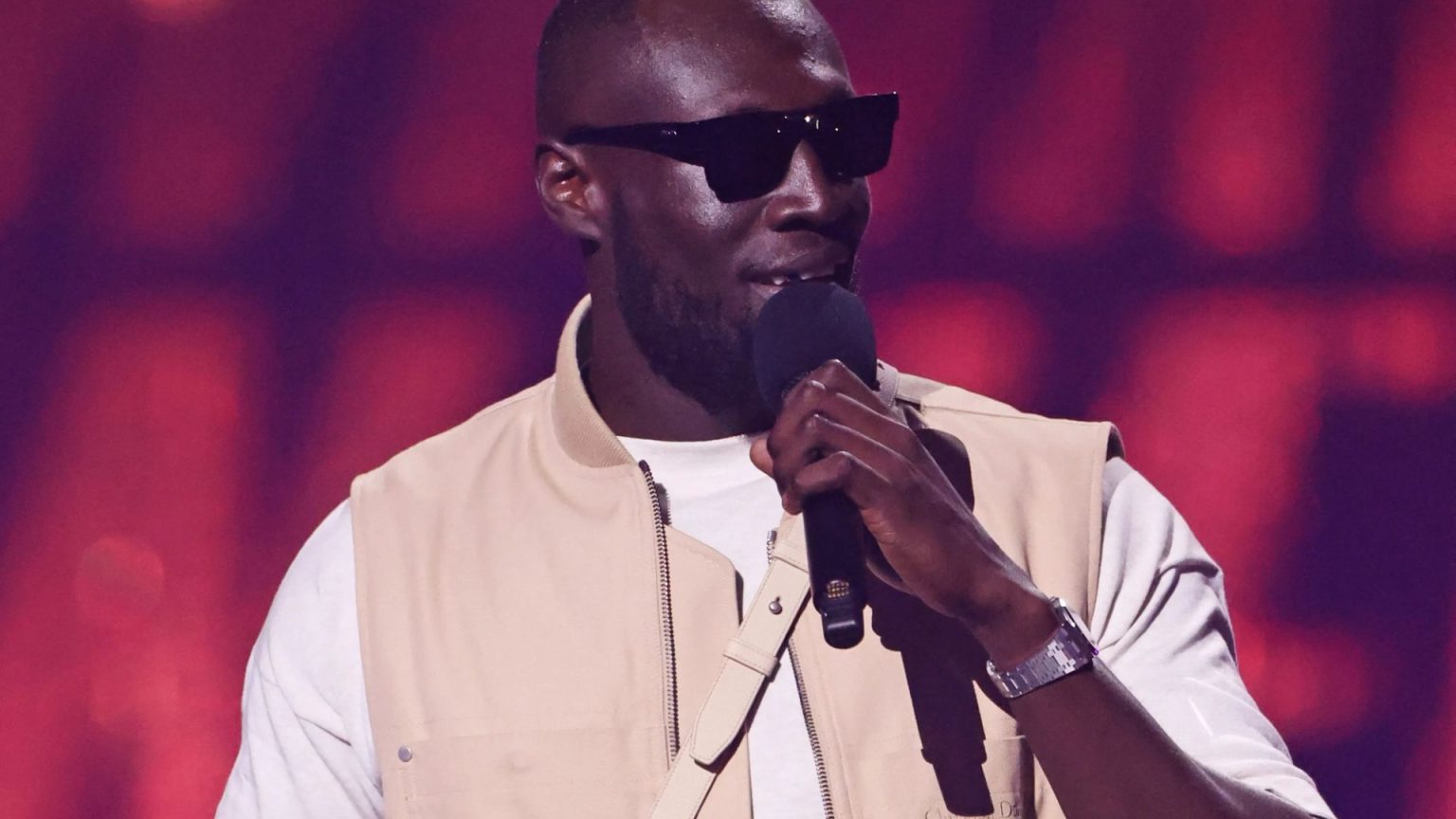 Stormzy struggles to read his notes as he’s forced to wear sunglasses on stage after painful injury
