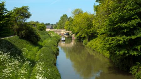 Woman crushed to death between narrow boat and side of canal after falling in as husband helplessly watched