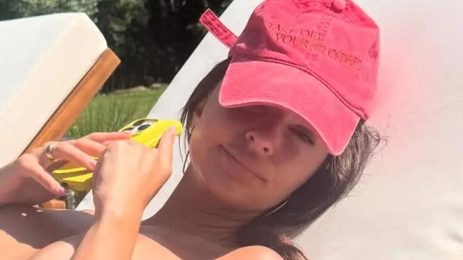 Emily Ratajkowsi strips naked to soak up the sun – and wears very cheeky hat