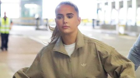 Molly Mae can’t raise a smile as she jets off on holiday with Tommy after moaning ‘not doing one fun thing’ in summer