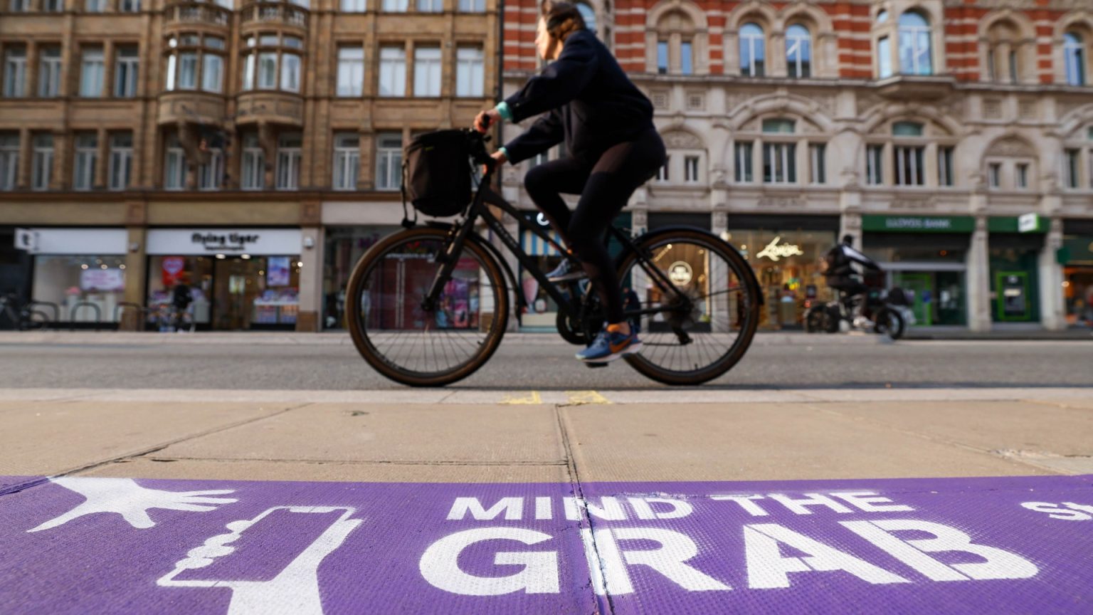 Giant signs painted on Oxford street warn Londoners to get off their phones amid record high snatches