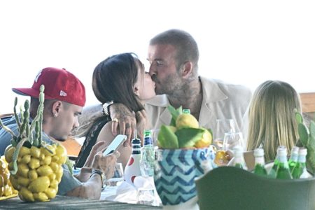 David and Victoria Beckham pack on the PDA at lunch as they ignore Brooklyn feud with the rest of their children