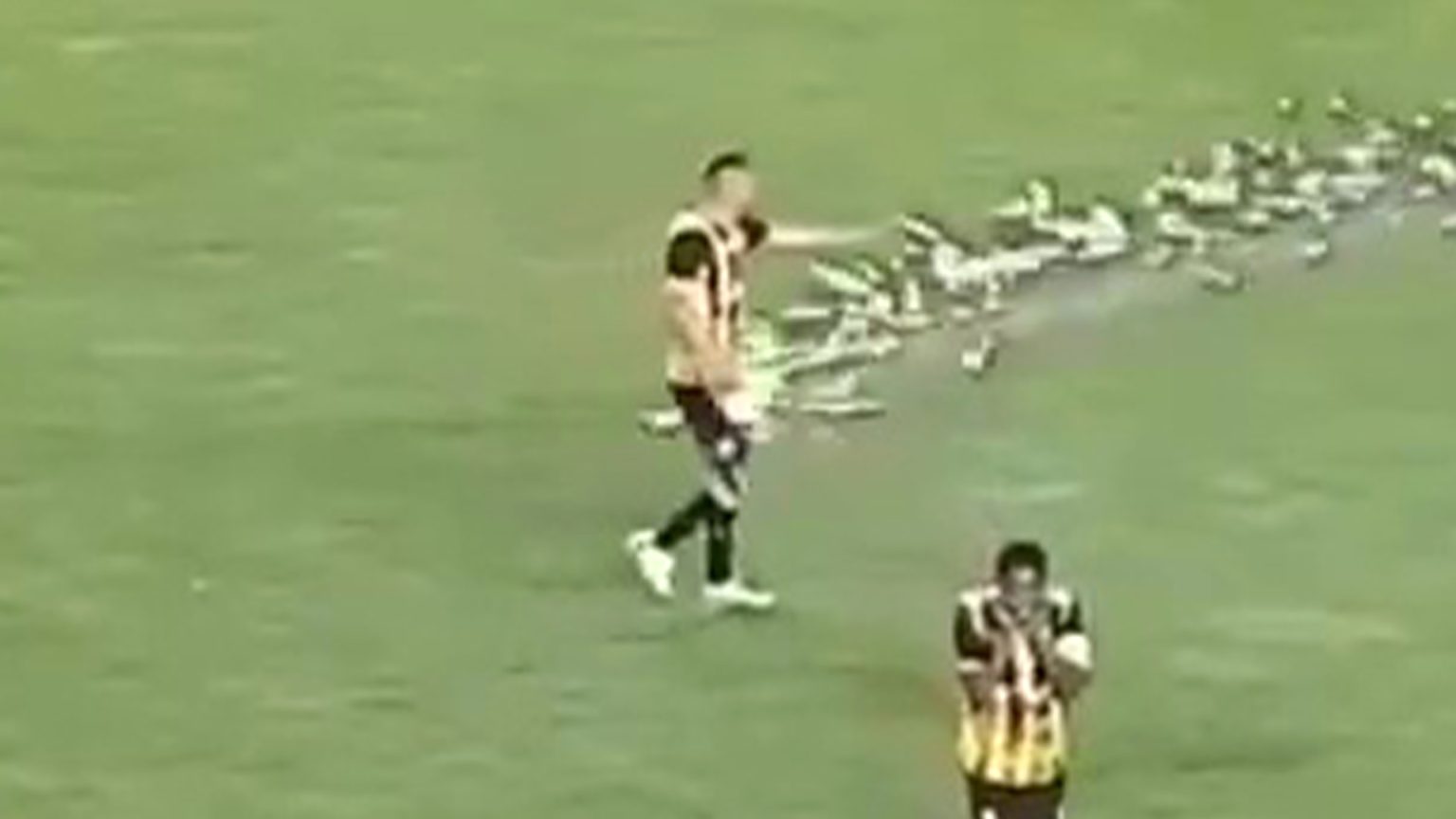 Shocking moment footballer collapses after he is hit in privates by firework and left with horror testicular injury