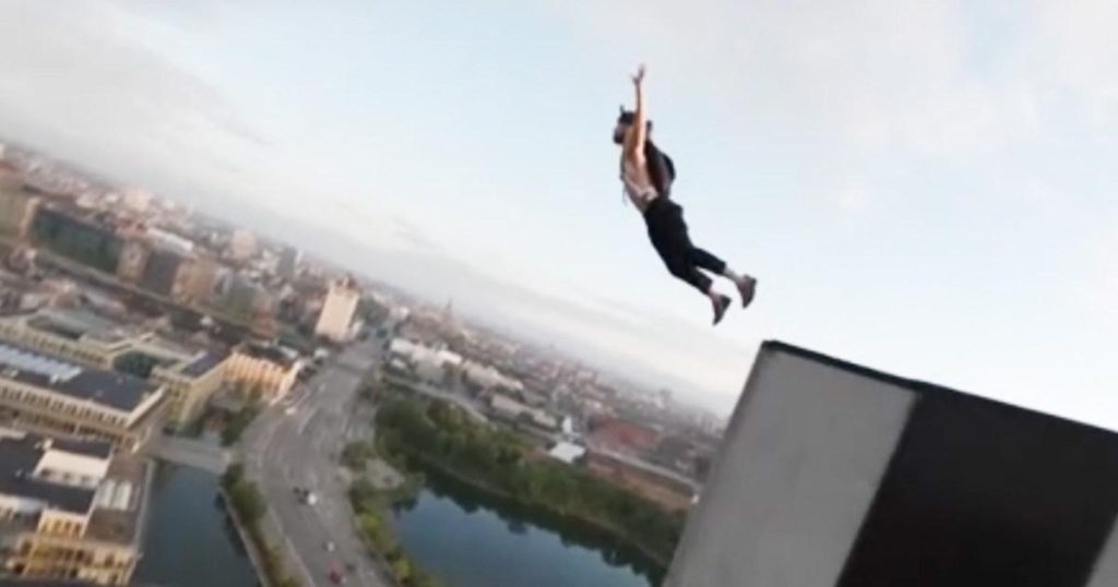 Daredevil scales Copenhagen’s tallest hotel before leaping from top