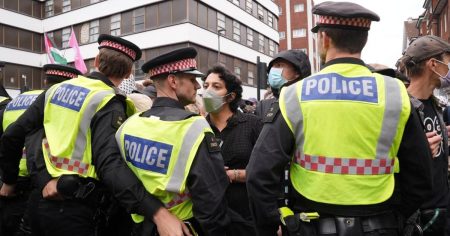 Protesters clash outside London migrant hotel