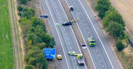 M11 closed after serious crash between a lorry and a car
