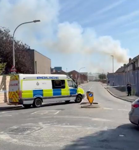 Huge fire breaks out in scrap yard with flames billowing through sky & locals warned not to drink tap water