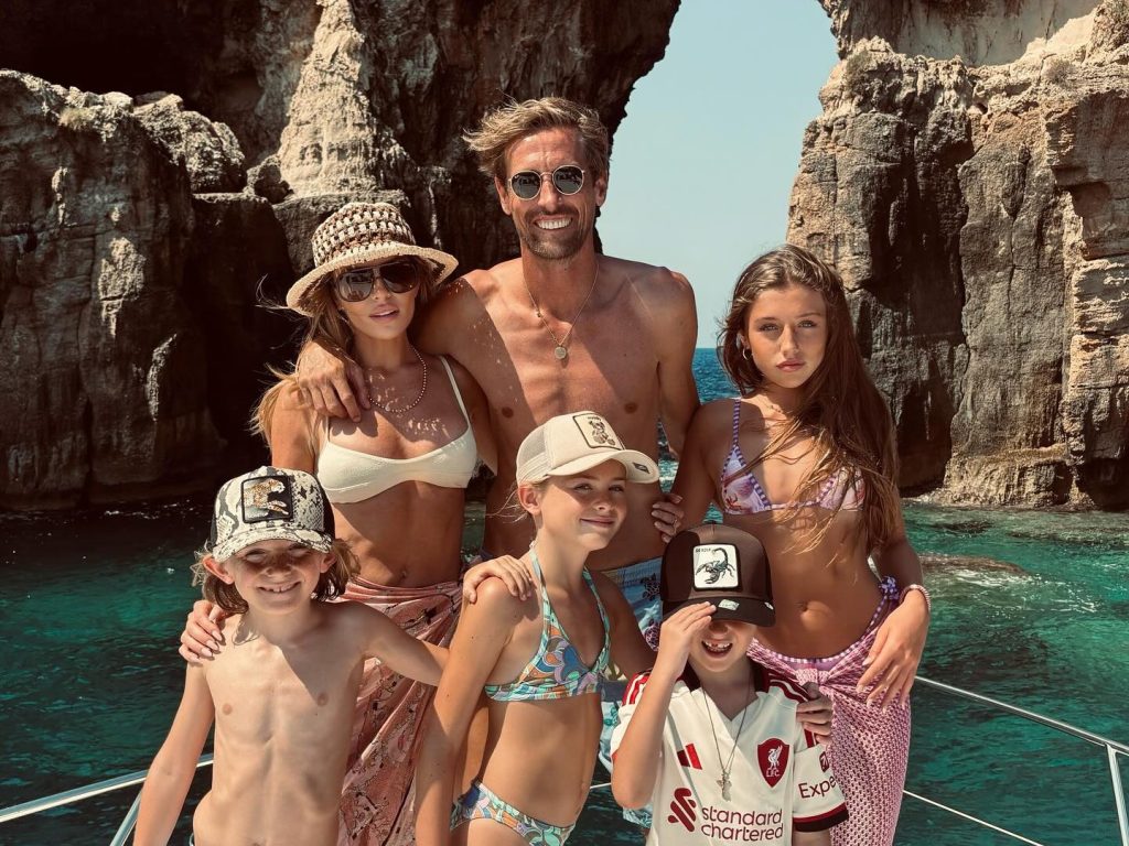 Abbey Clancy looks incredible as she strips to a bikini on family holiday with husband Peter Crouch and their four kids