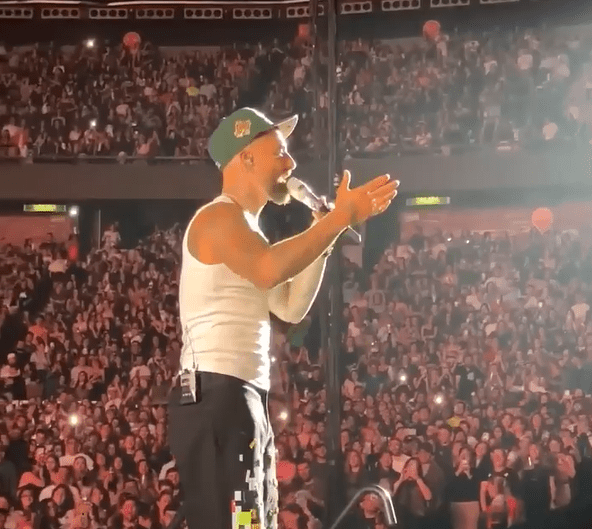 Moment rapper stops concert to 26,000 fans to berate ‘irresponsible’ mum who brought her one-year-old BABY to gig