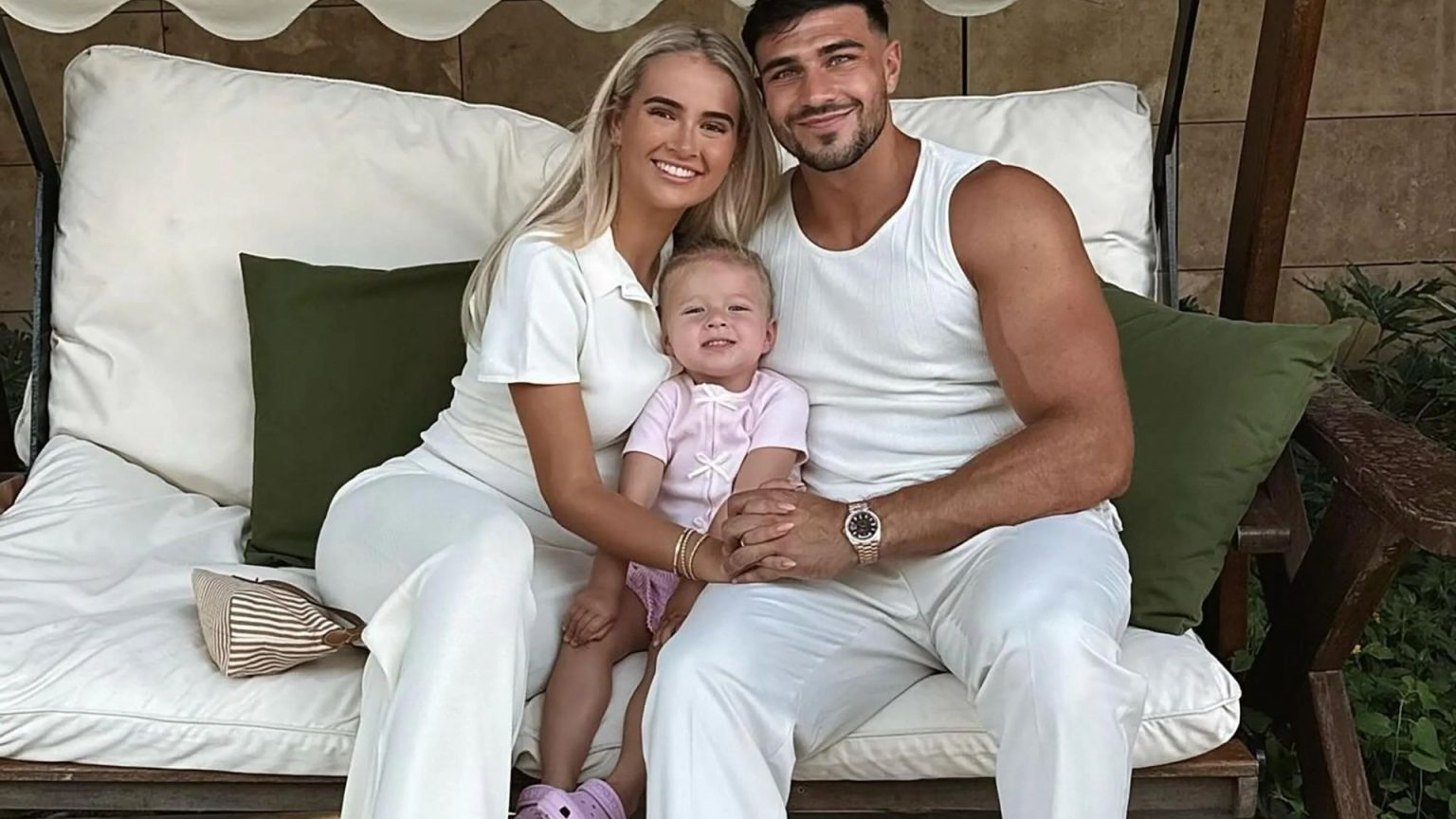 Tommy Fury cosies up to Molly-Mae and Bambi on family holiday after she revealed reason they don’t film together