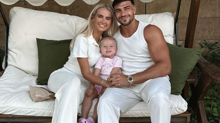 Tommy Fury cosies up to Molly-Mae and Bambi on family holiday after she revealed reason they don’t film together