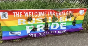 Pride flags set on fire and torn down but defiant LGBT+ group marches on
