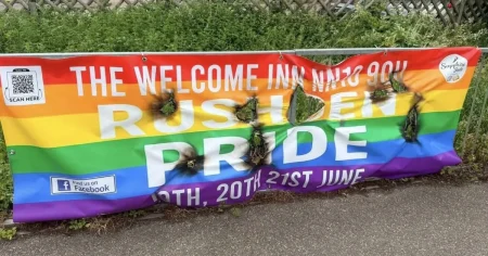 Pride flags set on fire and torn down but defiant LGBT+ group marches on