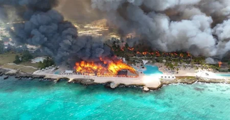 At least one dead and 1,700 evacuated after fire at luxury beach resort