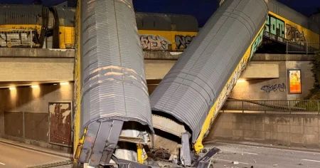 One dead after freight train derails and falls off bridge in Munich train crash
