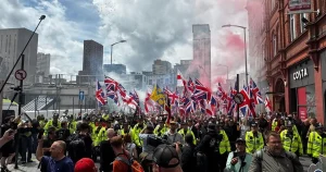 Hundreds of Britain First protesters set off flares in Birmingham