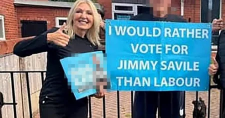 Reform councillor apologises after posing with poster endorsing Jimmy Savile