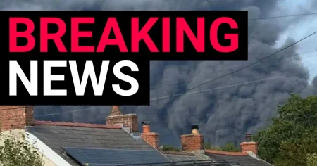 Huge inferno sweeps over oil refinery site as villagers urged to stay back