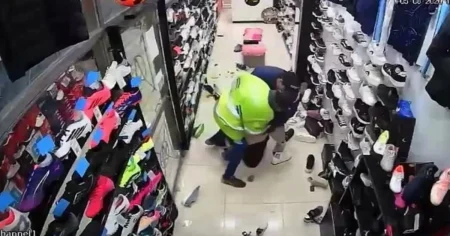 Pregnant shopworker punched and thrown to floor by robbers posing as customers