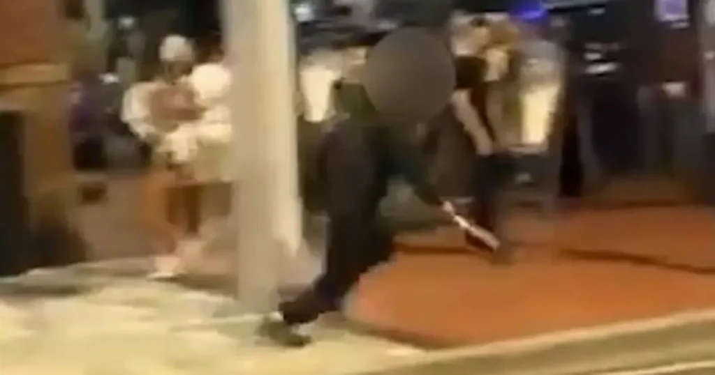 Teen wielding a machete chases man through street packed with people outside bars