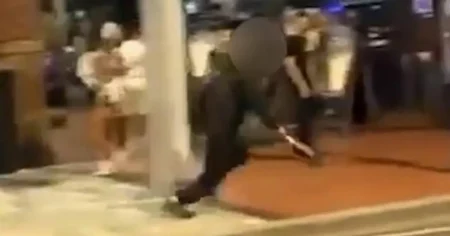 Teen wielding a machete chases man through street packed with people outside bars