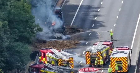 Lorry carrying bales of hay bursts into flames bringing motorway to halt