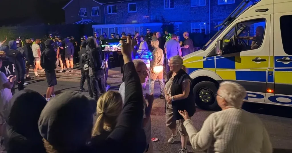 Police bitten and spat at after mobs ‘target asylum seeker homes’