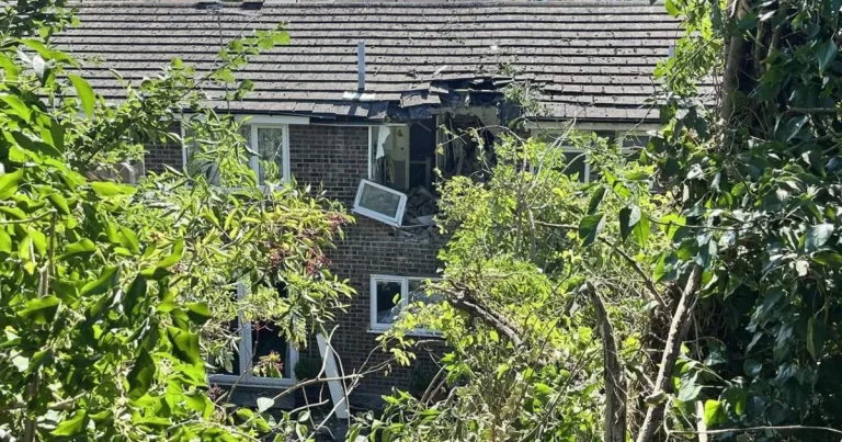 A car has somehow managed to crash into the top floor of a house in Kent