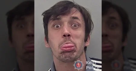 Bully who stuck his tongue out for mugshot after strangling woman is jailed