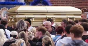 Boy, 15, killed in wrong-way motorway crash is carried in gold coffin at his funeral