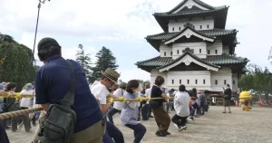 Hundreds pull giant castle for repairs in epic tug-of-war