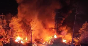 More than 140 vehicles destroyed in fire and pensioner, 67, arrested for arson