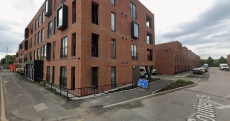Man fighting for life after falling from balcony as police make arrest
