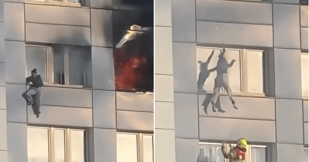 Moment woman jumps from burning 11th-floor building
