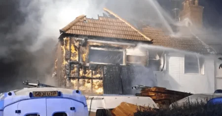 Car destroyed and huge hole left in roof after London house fire