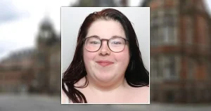 Woman smirks in mugshot after threatening 999 workers with a broken bottle