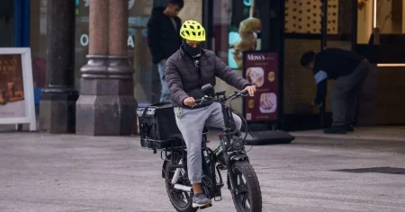 Masked men in Nottingham defy face covering ban by taking to streets