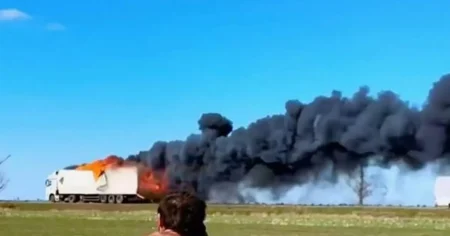 Moment Russian supply trucks speed away in flames from Ukrainian drone strikes