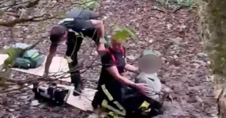 Arsenal fan storms out of home after loss only to rescue woman stuck in mud