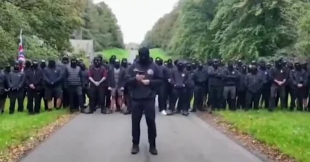 Police break up 100 masked ‘patriots’ delivering anti-migrant message to PM in front of Lancashire estate