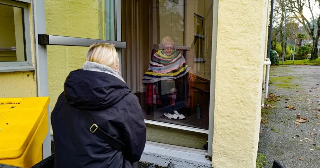 Family members ‘should have been allowed into care homes earlier in Covid outbreak’