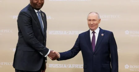 Putin brutally mocked for photo with president who towers over him